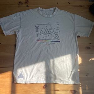 A white nike shirt. an oversized fit.